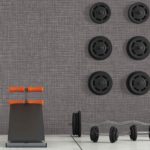 Concrete room with stationary bike, abdominal bench and weight - 3d rendering